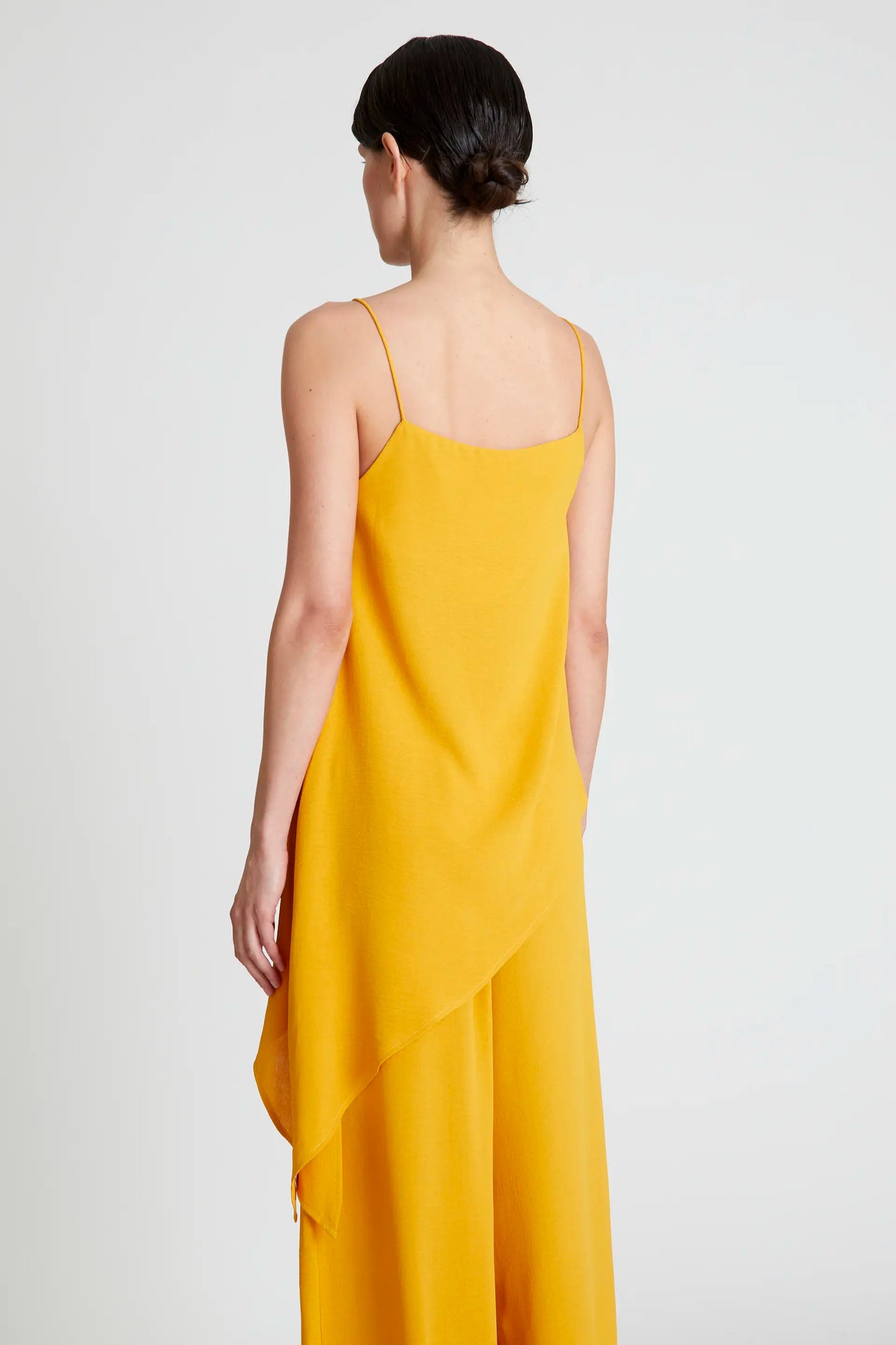 Top asimmetrico con spalline giallo