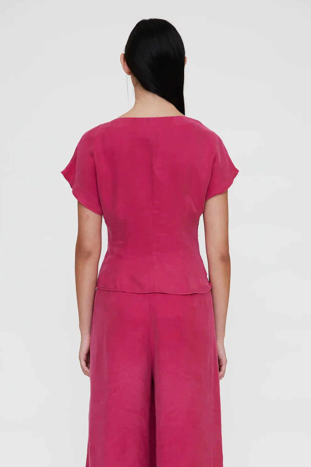 Top fucsia con scollo incrociato