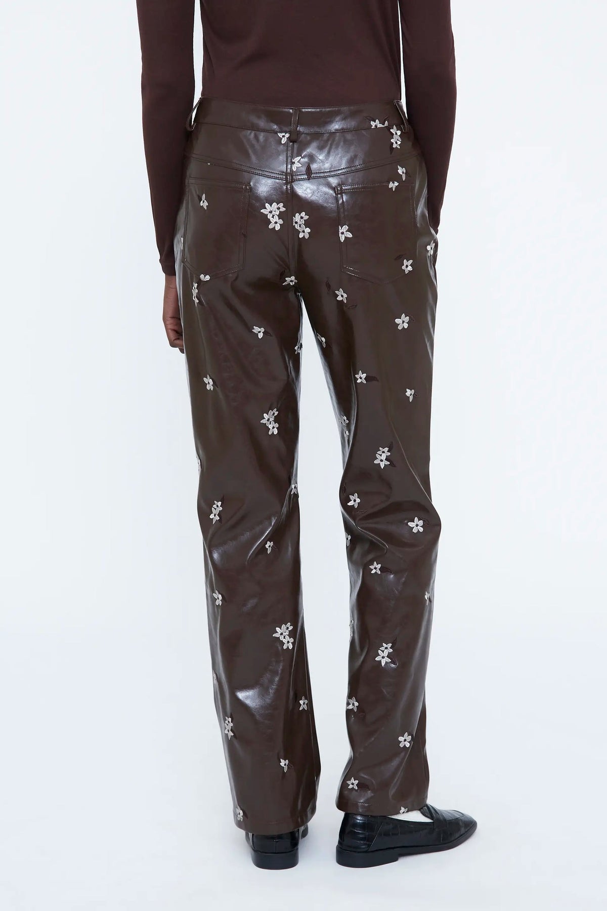 Pantaloni in ecopelle con stampa a mandorla
