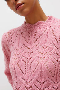 Maglione rosa lavorato a maglia traforata