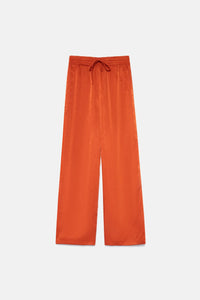 Pantaloni fluidi in raso arancione