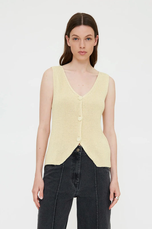 Top a maglia con bottoni gialli