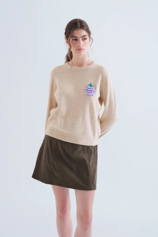 Maglia beige con dettaglio uva