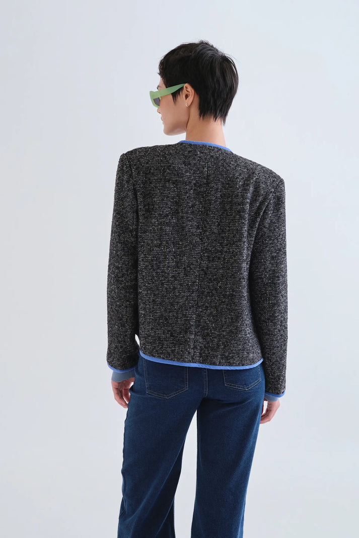 Giacca in tweed nera con dettagli azzurri
