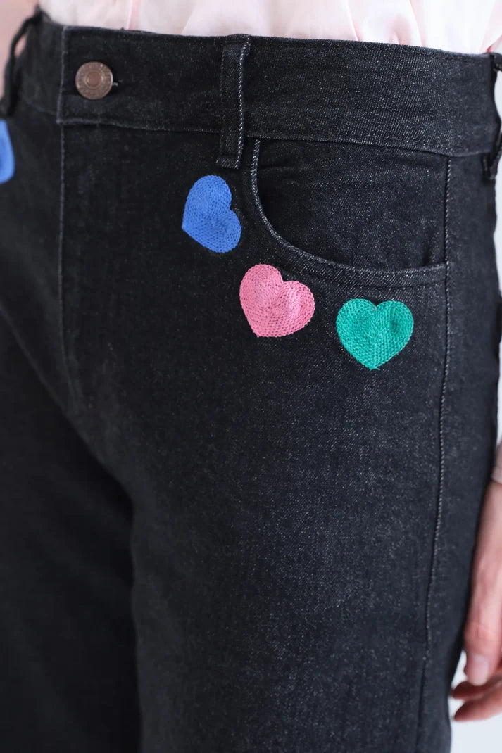 Jeans neri con stampa Candy