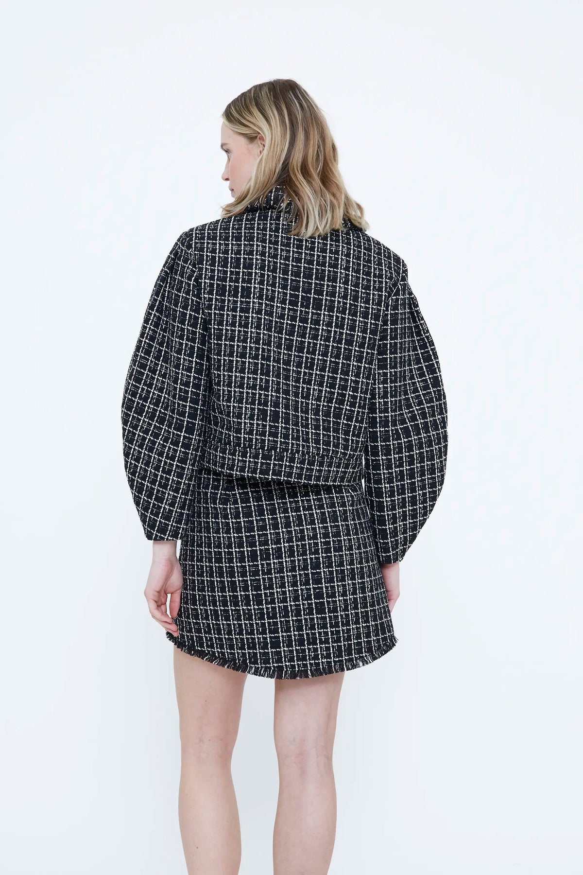 Giacca in tweed nero con dettagli sfilar