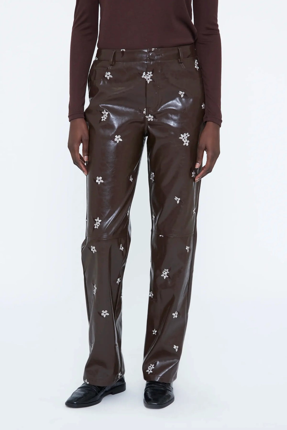 Pantaloni in ecopelle con stampa a mandorla