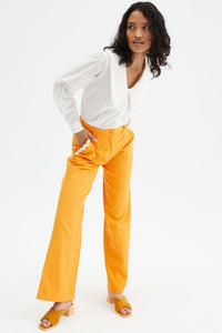 Pantaloni ampi a vita media con passamaneria arancio